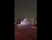 Storm trooper looking person sprays fire extinguisher 