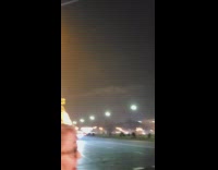 Woman stands in night road Eiffel Tower picture