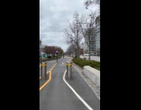 Woman printed jacket ride tall unicycle street