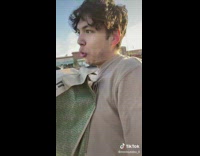 Guy holding huge bag of doordash wings order 