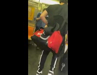 Lady wearing black lace bodysuit enters subway 