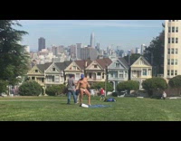 Shirtless guy hangs out in park