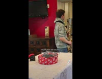 Boy with saxophone playing song request in living room