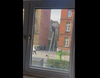 Woman in green suit off shoulder at the street