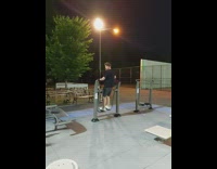 Guy use elliptical walking machine park night part 2