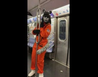 Two girls wear cat astronaut costumes and meow on subway 