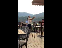 Woman positions its arms to hold the sun for a photoshoot