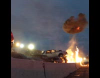 Car on ramp hits top stacked car