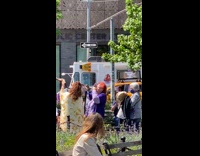 Three Women Play Instruments with Horns and Drum 