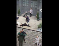 Lady with baby in stroller interrupts tv filming set