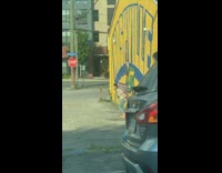 Girl jump shot nashville wall stop sign