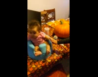 Carved pumpkin tries to wear it to the baby but cried