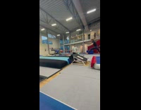 Girl does a summersault and falls down 