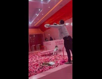 Woman lay in pool of large sprinkles