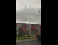 Guy in car film cloudy sky lightning