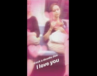 Woman pets brown chicken on her lap on subway train heart filter song