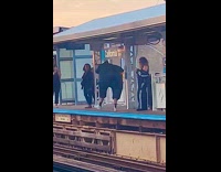 Collab Subway Creatures - Man wear black bodysuit inflatable train station