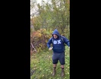Guy struggles to get fish off hook 