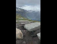 Woman pink jacket bicycle kick exercise raining