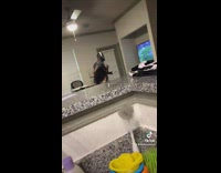 Partner watches her man carry their kid while playing games 