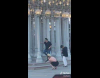 Family goofing around while taking photos at LACMA