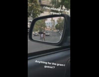 Two girls stand street car mirror flash