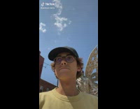 Boy slaps metal statues butt