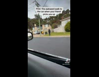 Man awkwardly walks to friends car 