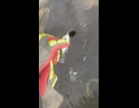 Guy throws fish outside of water back but misses water 