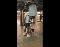 guy irons clothes subway station