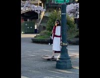 Guy Dressed as Jesus Skateboards on Cross 