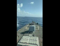 Blue cannon on black boat ocean