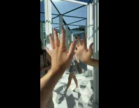 Girl accidentally touches mans face in mirror maze 