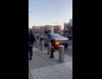 Cybertruck on road with speaker plays music