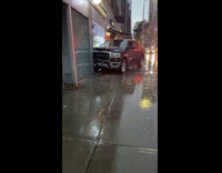 Car crashed on building during rainy night