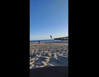 Woman pole dance video beach blue sky