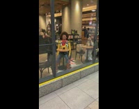 Guy toy story woody costume sits starbucks 