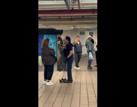 Man being filmed performing with skeleton puppet 