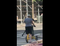 Woman use walking bike cross the street