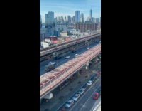 Guy sits in car in middle road