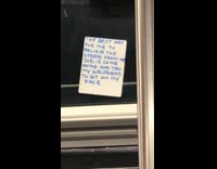 Handwritten note subway window grey sweater guy