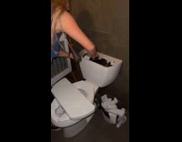 Woman fixes toilet at bar 