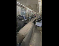 Men Sits on Couch Inside Subway Train