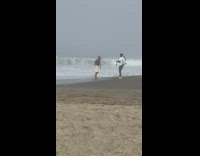 Man in shorts rap talk at beach