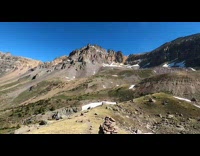 Girl runs through melting snow mountain dirt