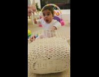 Baby girl excited over giraffe squeaky toy