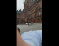 White shirt guy music video brown building 