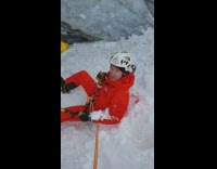 Guy goes iceclimbing, pick breaks ice and guy falls on ground