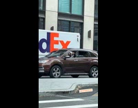 Collab WINY - Man inside a brown car sings and dance to music