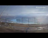 Guy flies drone around baseball field outdoors